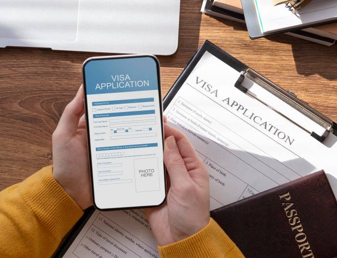 A Person Filling Visa Application at Skybird International